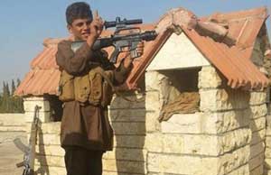 عکس کودک شیرخوار مسلح عضو داعش عکس کودک شیرخوار مسلح عضو داعش